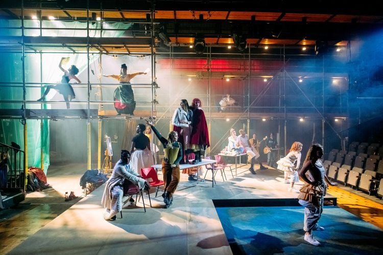 Actors dance and perform on stage in Provok'd